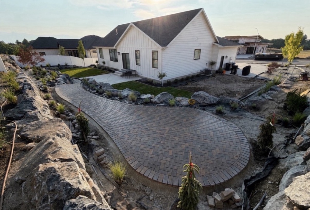 Large curved paver patio and walkway installation